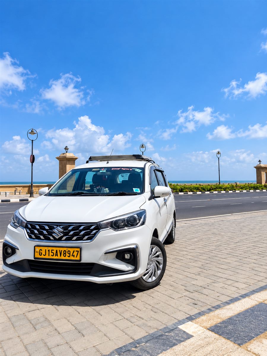 Parth Tours Maruti Suzuki Ertiga on a seafront drive